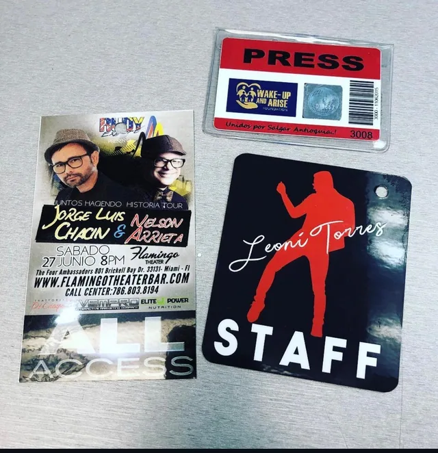 Printed event staff and press passes displayed together