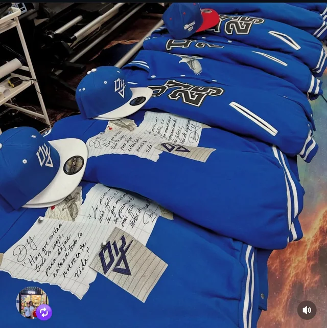 Blue custom printed varsity jackets and matching caps at Masters of Print in Miami